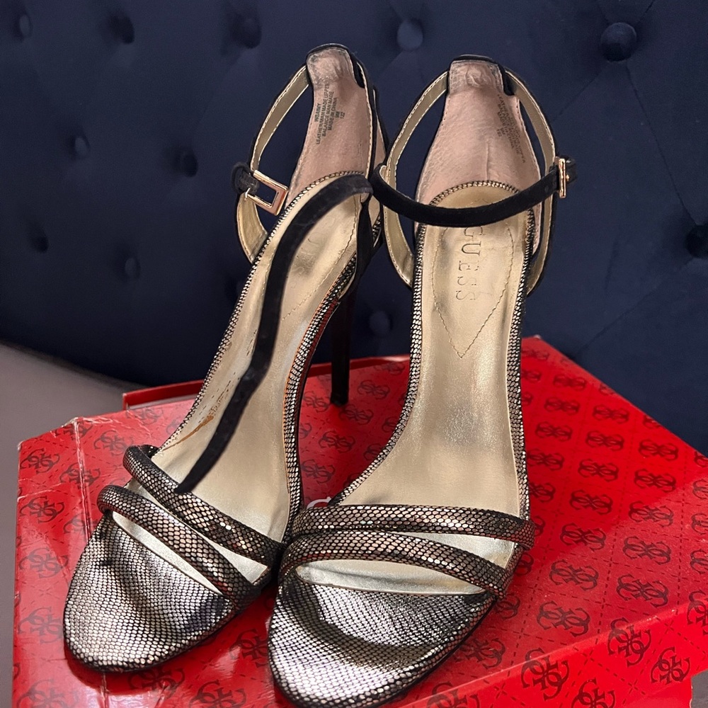 Beautiful black side and gold stiletto dressy shoes.